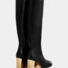 Botas de cuero doradas hasta la rodilla