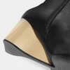 Botas de cuero doradas hasta la rodilla