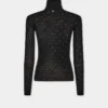 Jersey de cuello alto de lana que se adapta como una segunda piel