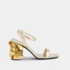 Sandalias doradas con tacones de disco Sparkle