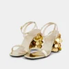 Sandalias doradas con tacones de disco Sparkle