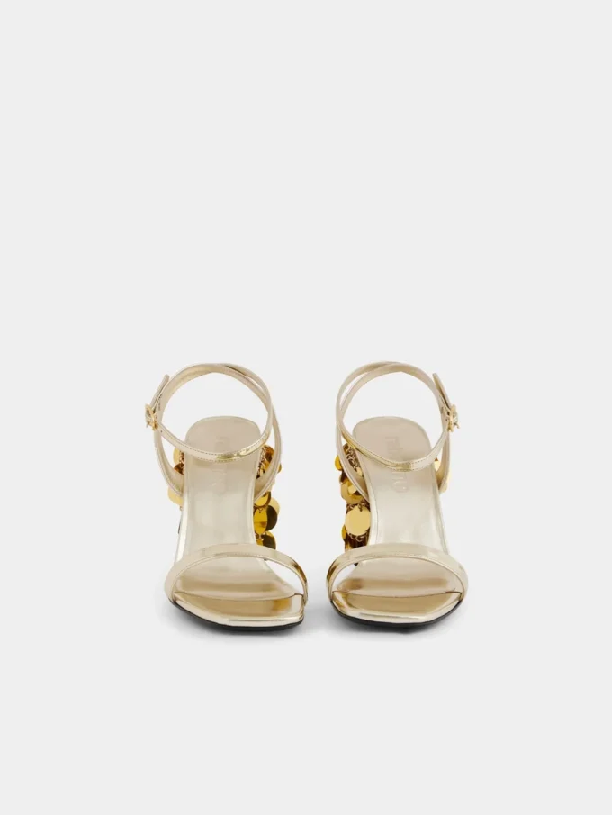 Sandalias doradas con tacones de disco Sparkle