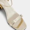 Sandalias doradas con tacones de disco Sparkle
