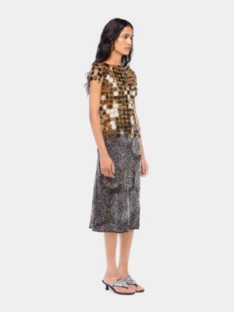 Top dorado con discos brillantes