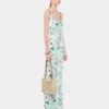 Vestido con estampado floral y detalles de cadenas