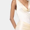 Vestido largo sin mangas de color crema en jersey